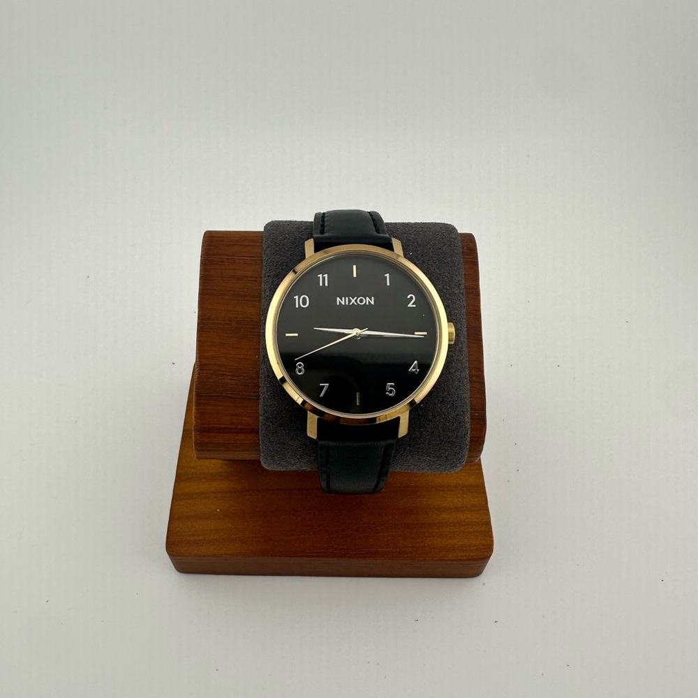 Nixon Gold and Black Timepiece